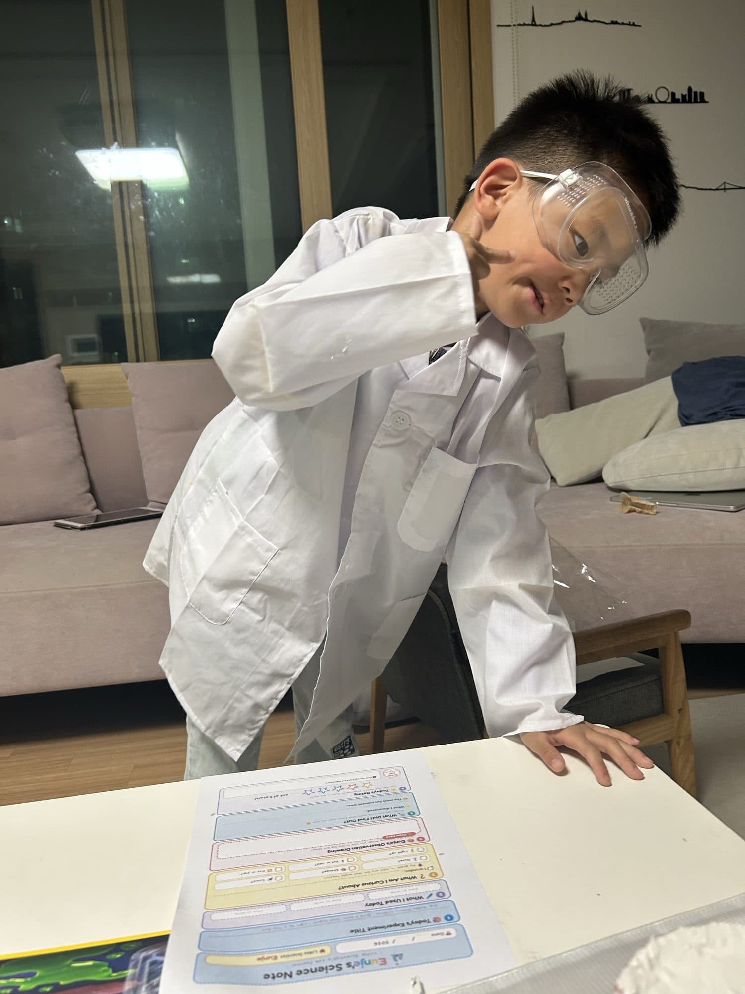 Me in goggles next to my science note